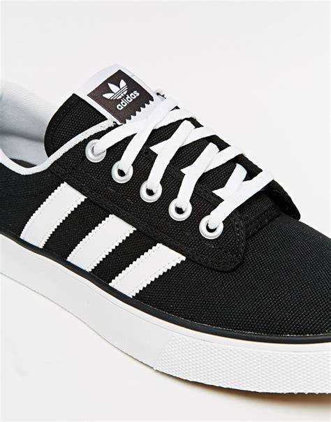 Adidas white canvas shoes